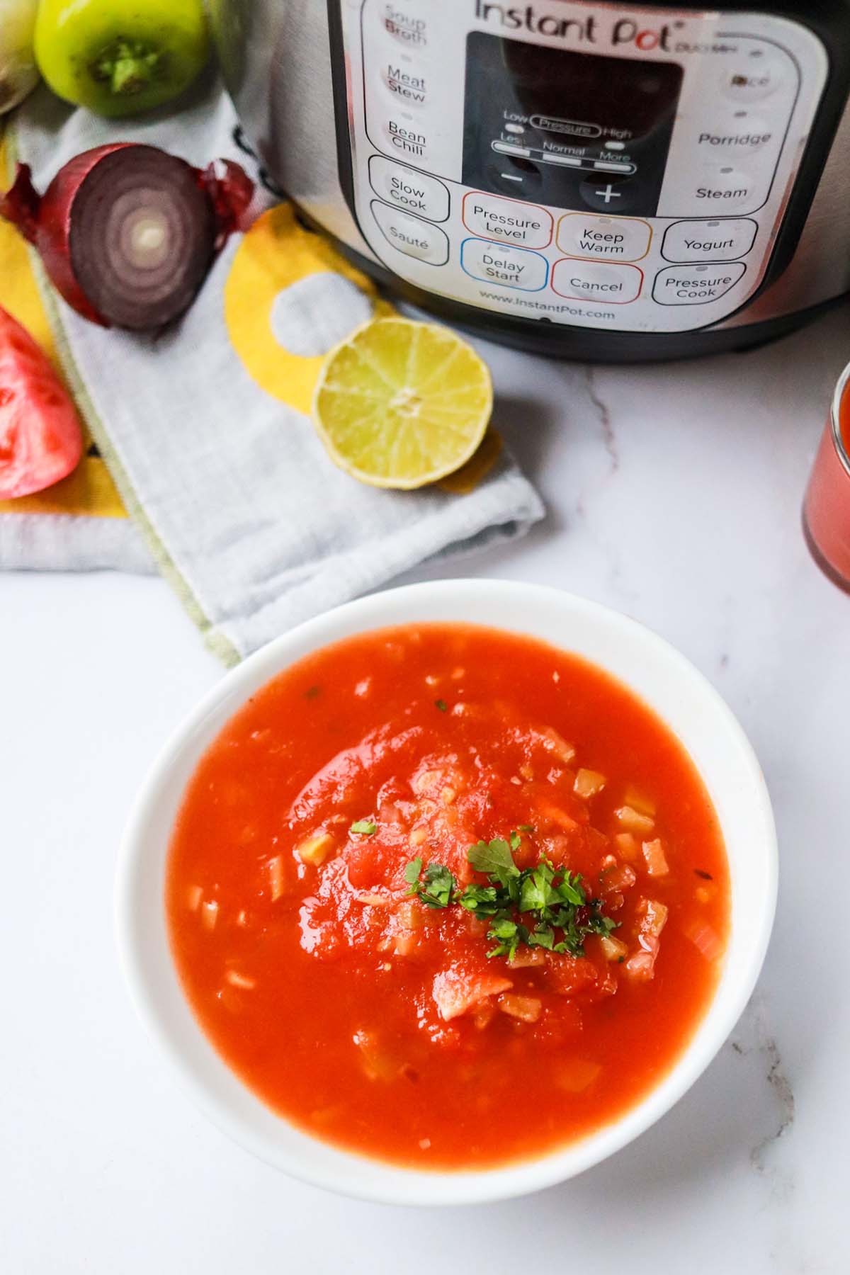 Salsa in a bowl in front of the Instant Pot.