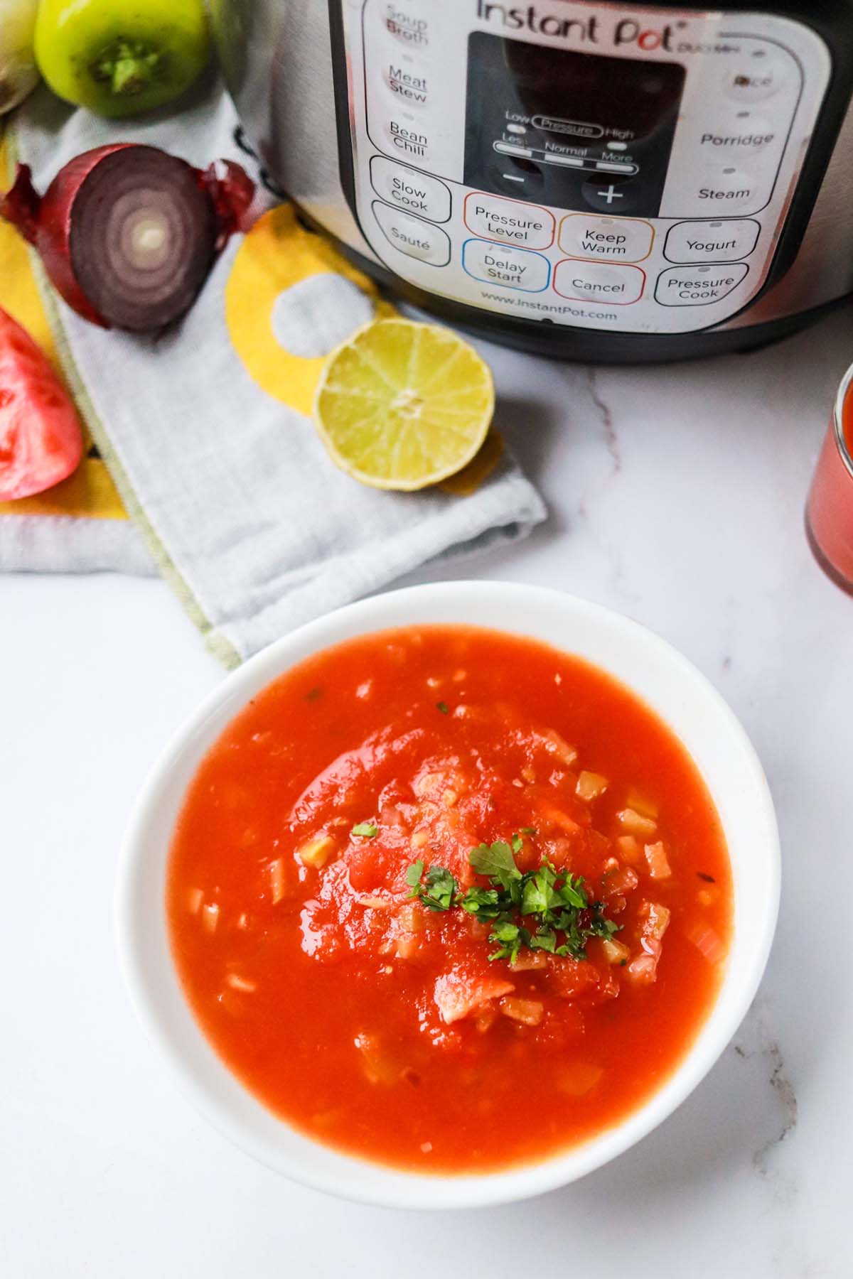 Salsa in a bowl in front of the Instant Pot.