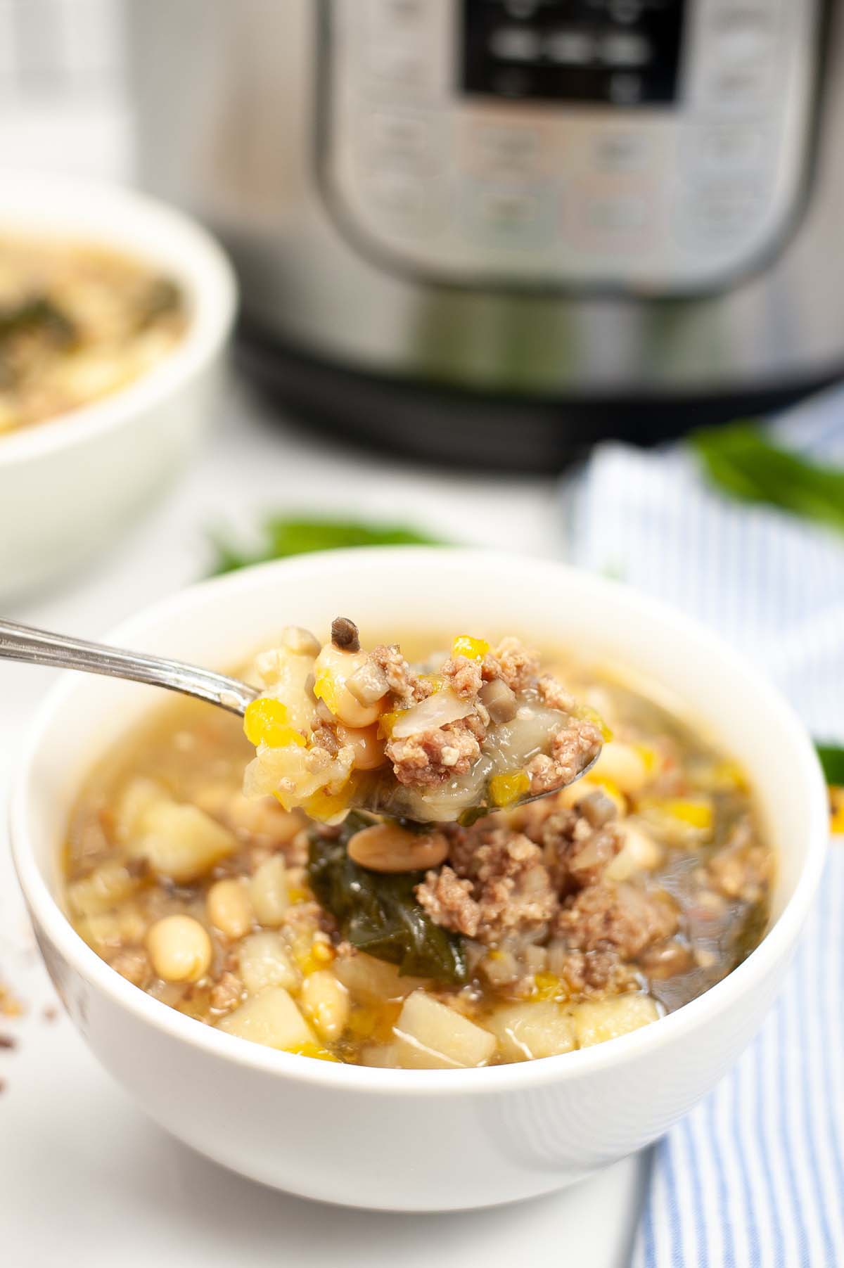 Soup scooped on a spoon.