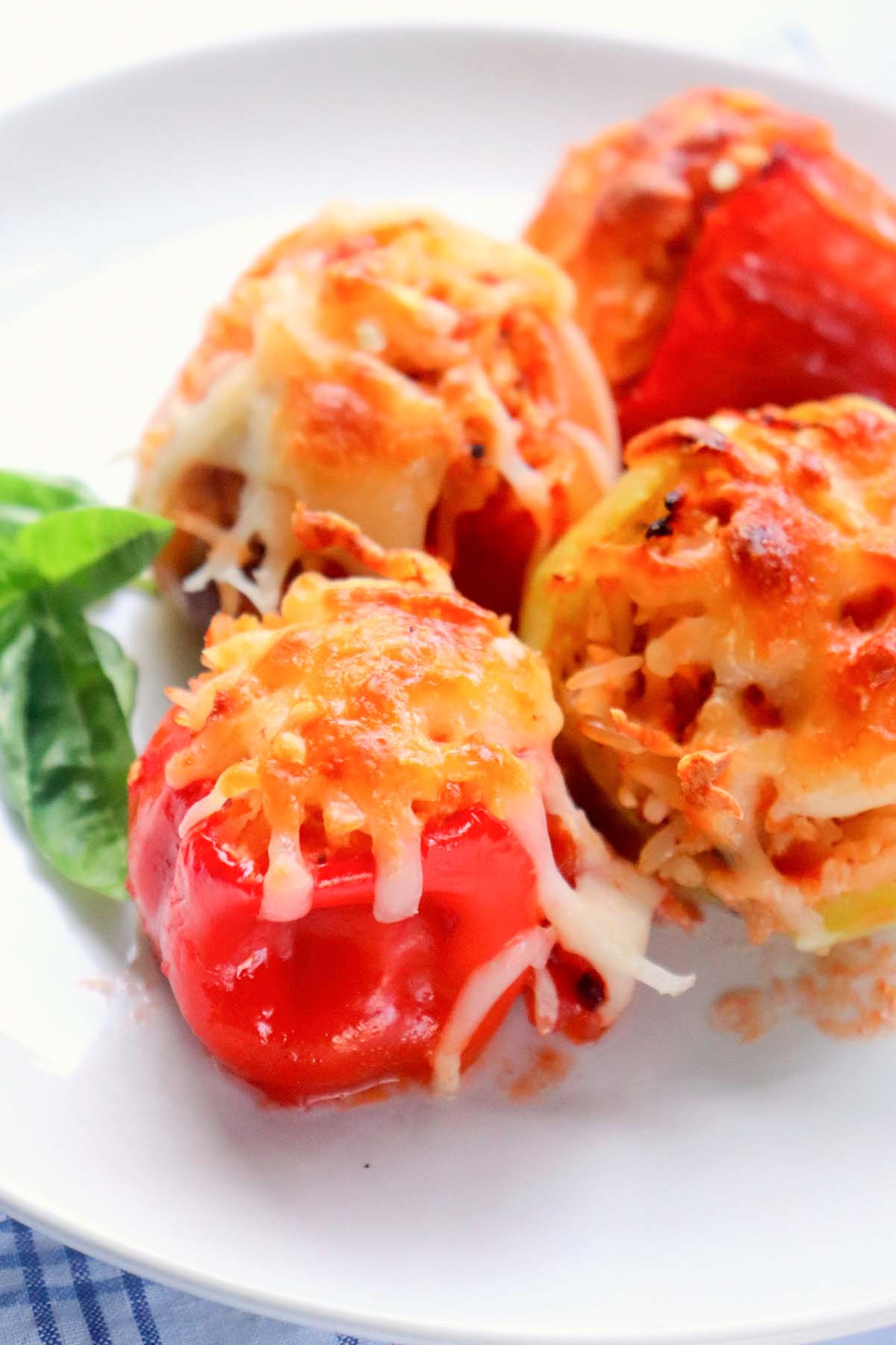 Stuffed peppers on a white plate.