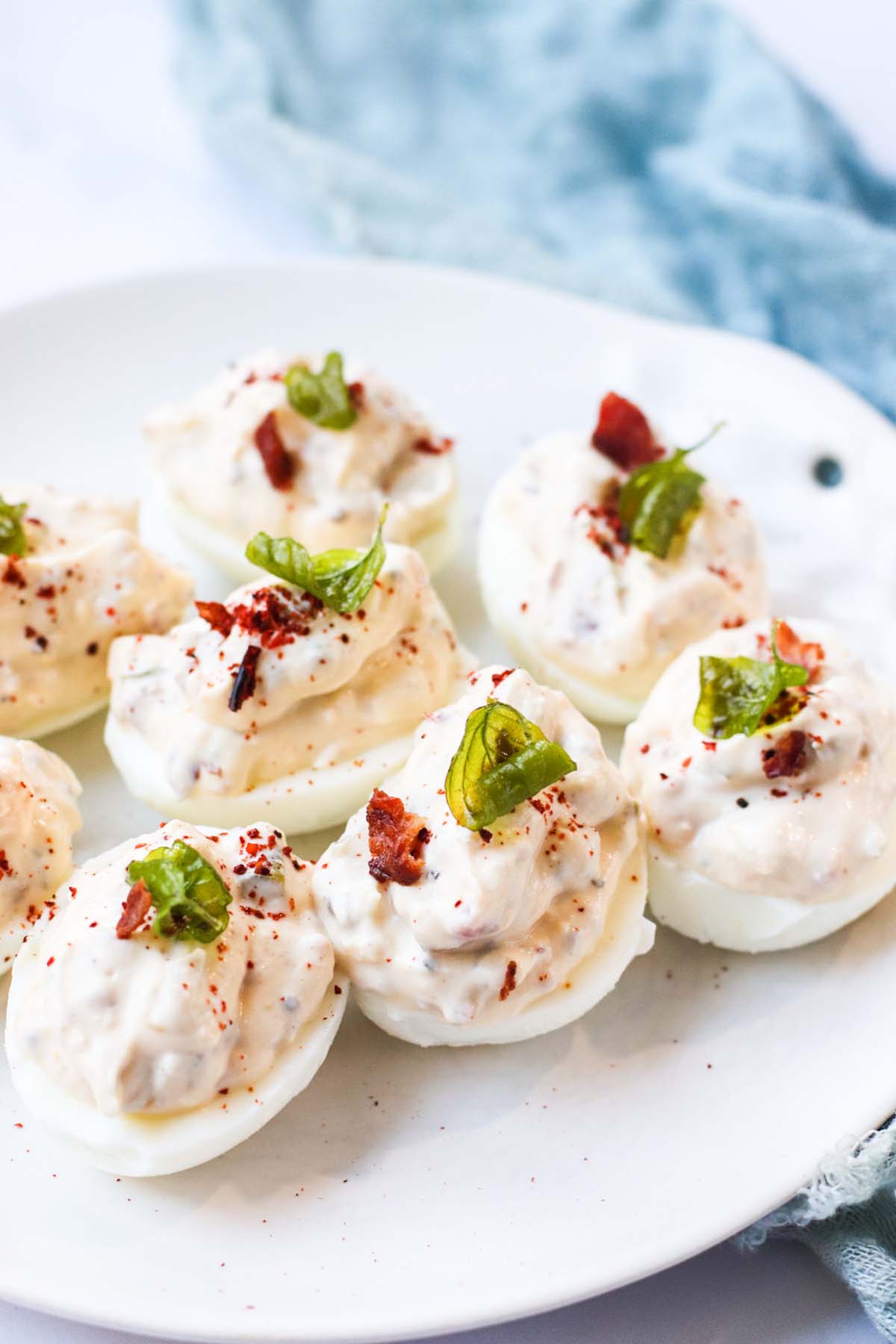 Deviled eggs on a white plate.