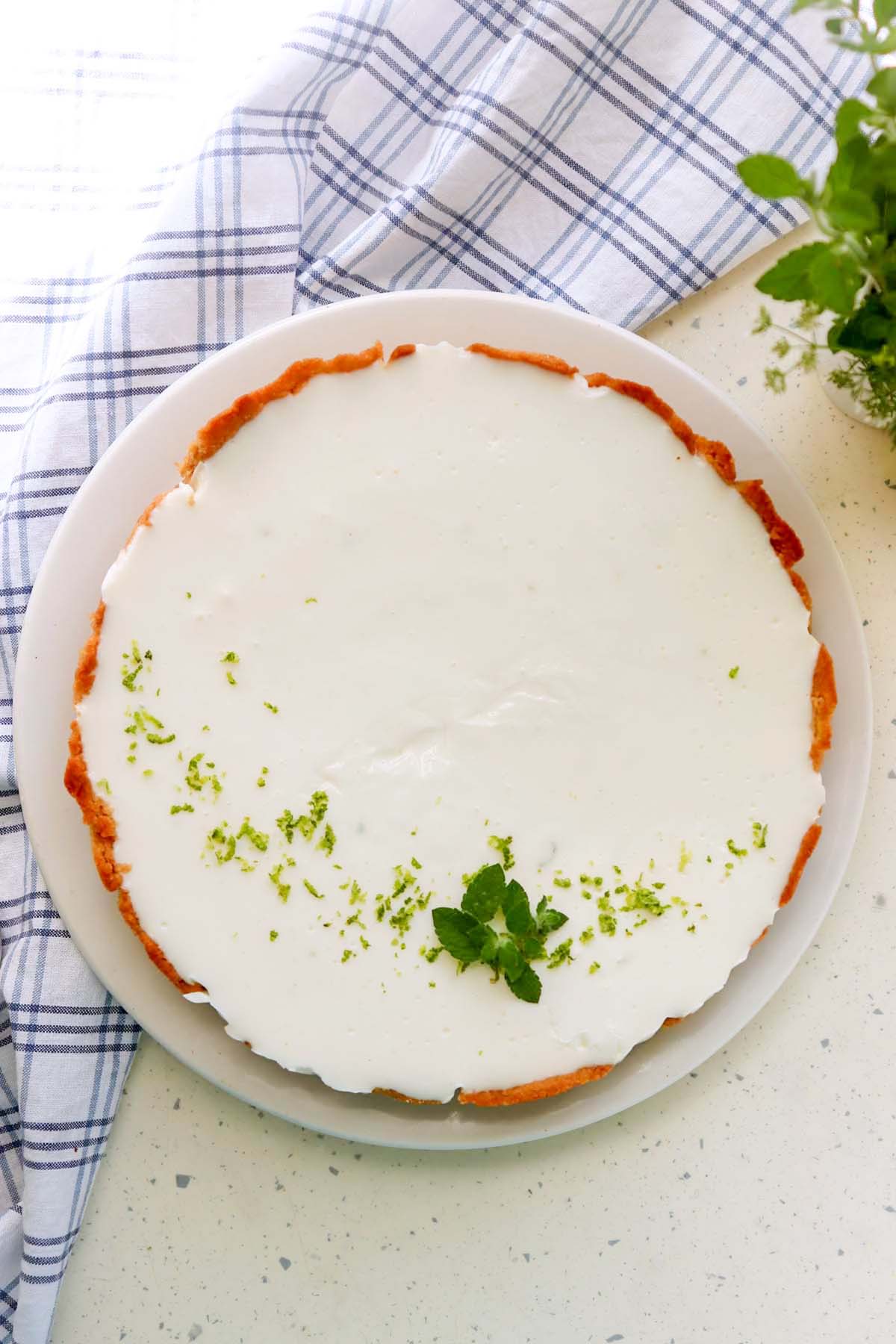 A whole pie on a white plate.