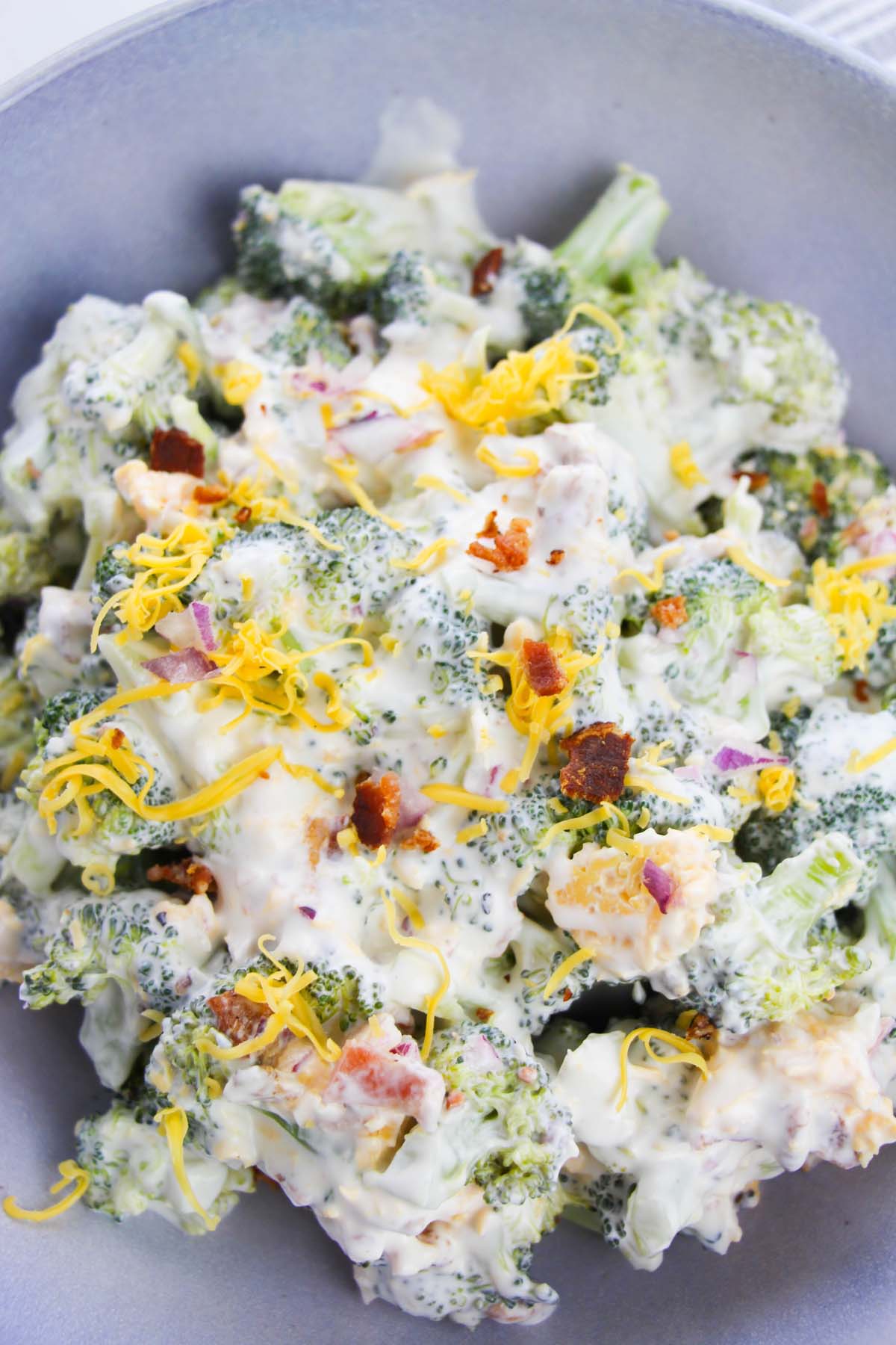 Broccoli salad topped with bacon bits.