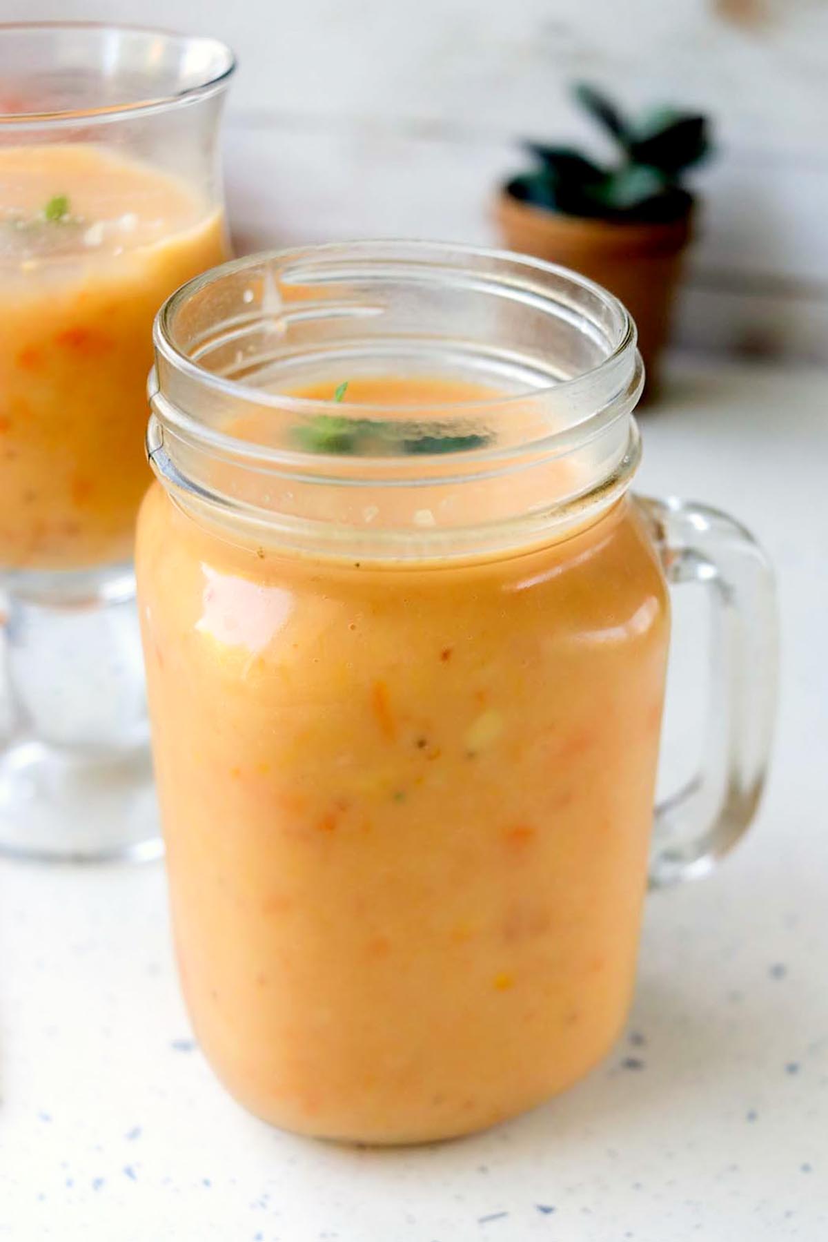 Orange drink in a mason jar.