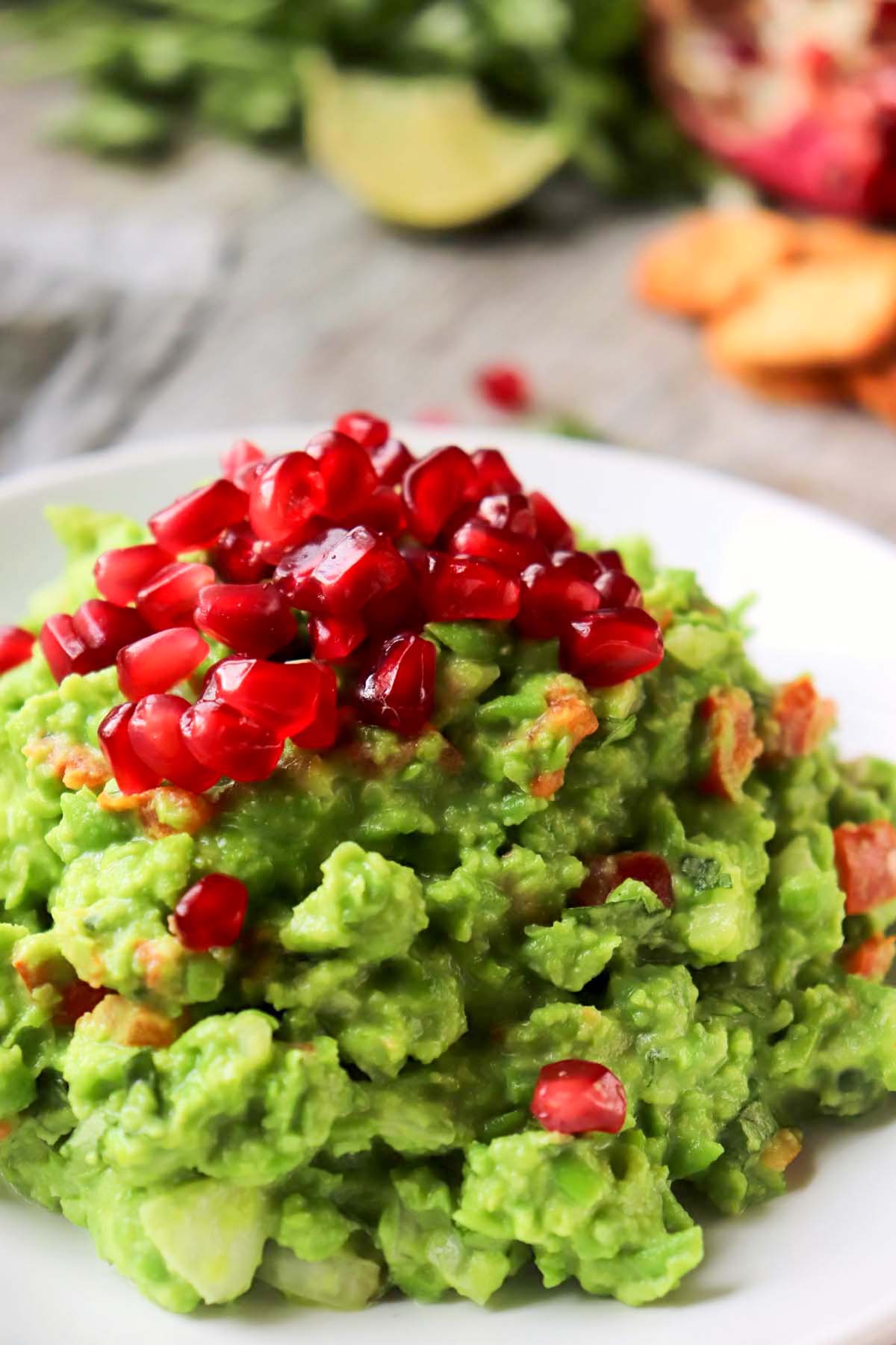 Guacamole topped with pomegranate seeds.