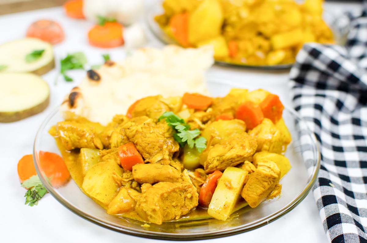 side view plate of curry chicken.