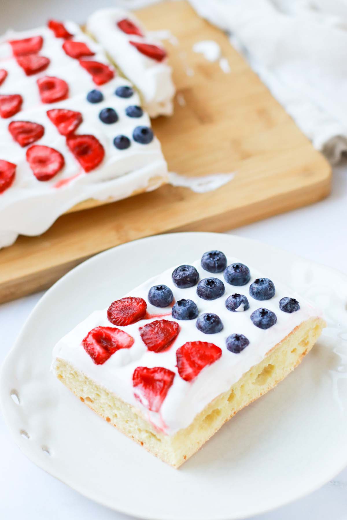 Slice of cake on a white plate.