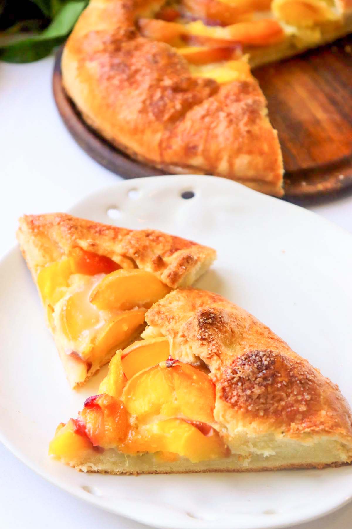 two slices of peach galette on a plate.
