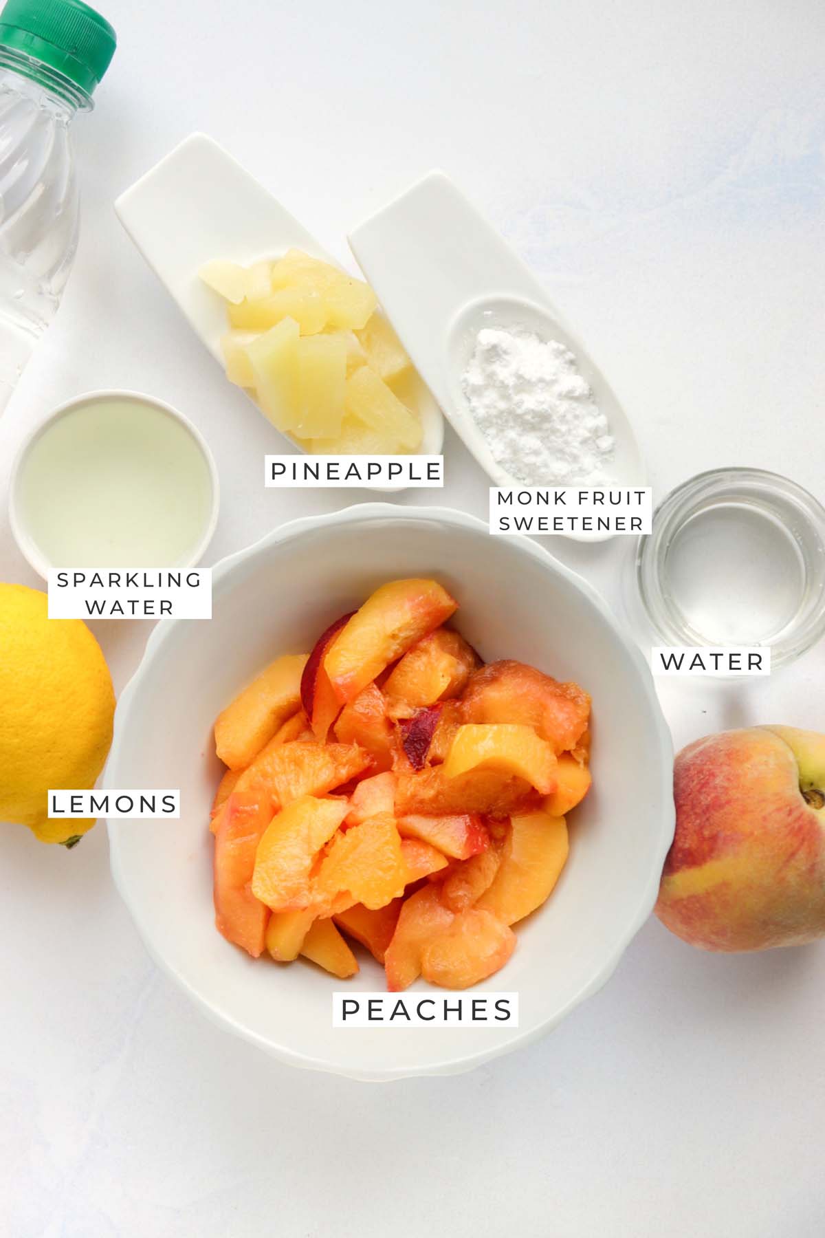 sparkling lemonade with pineapple and peach labeled ingredients.