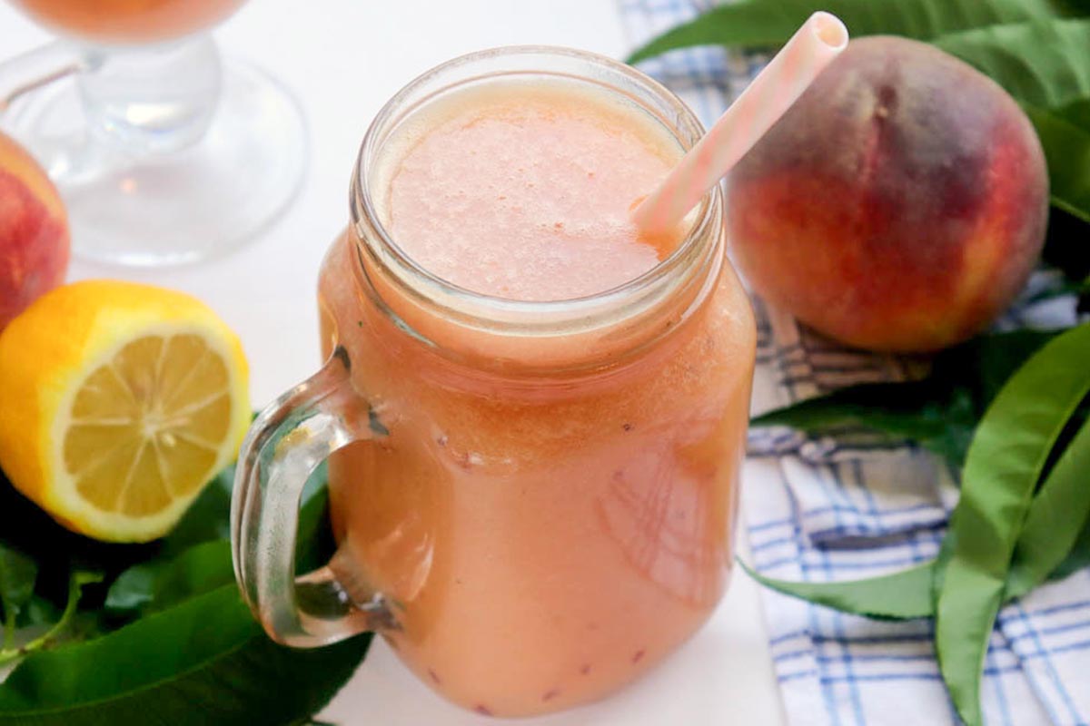 Lemonade in a jar with a straw.