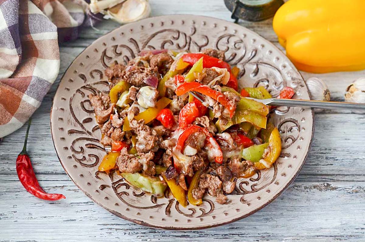 Stir fry on a plate with a fork.
