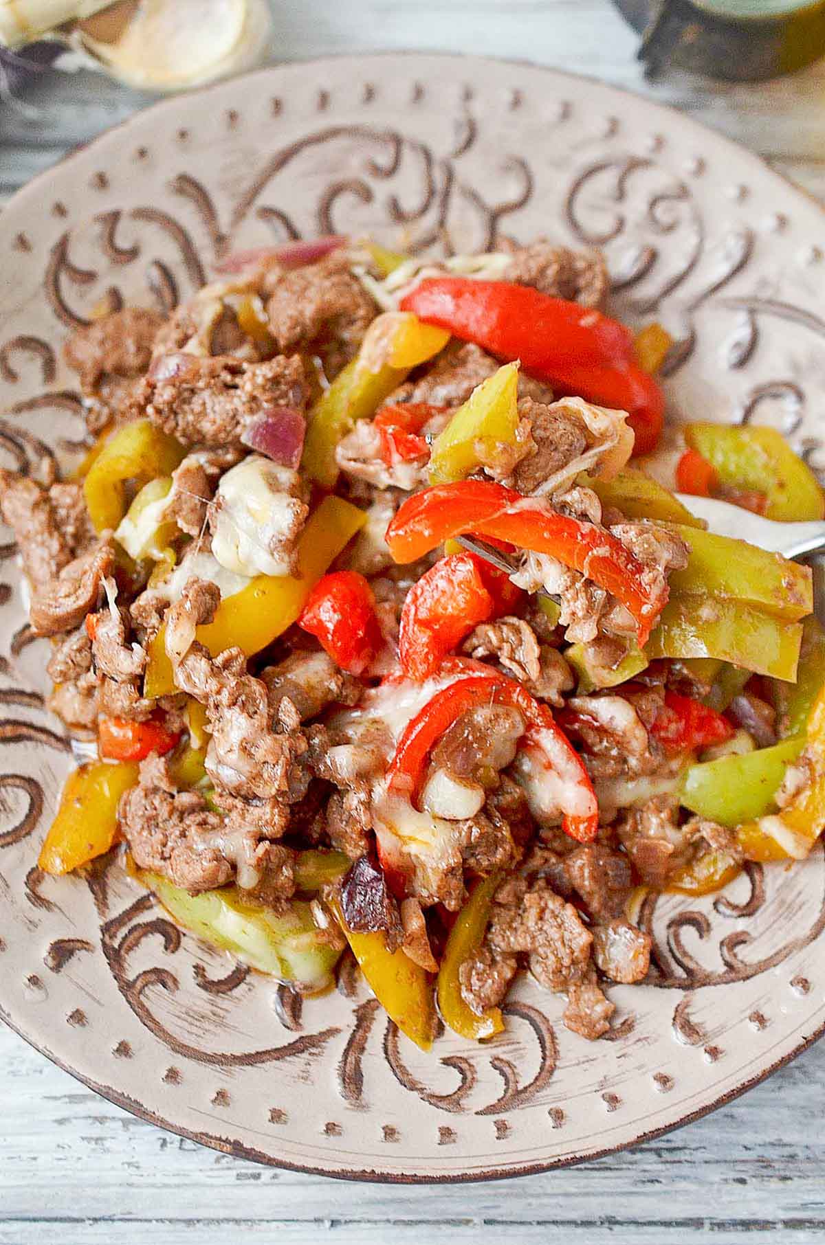 Beef and peppers on a plate.