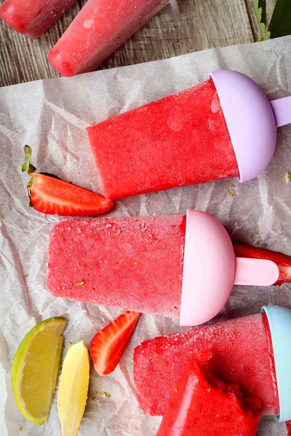 strawberry popsicles on parchment paper.