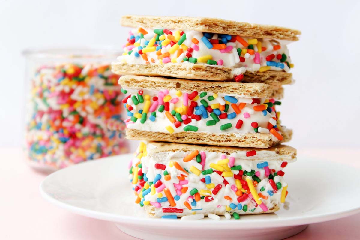 Stacked graham cracker sandwiches on a plate.