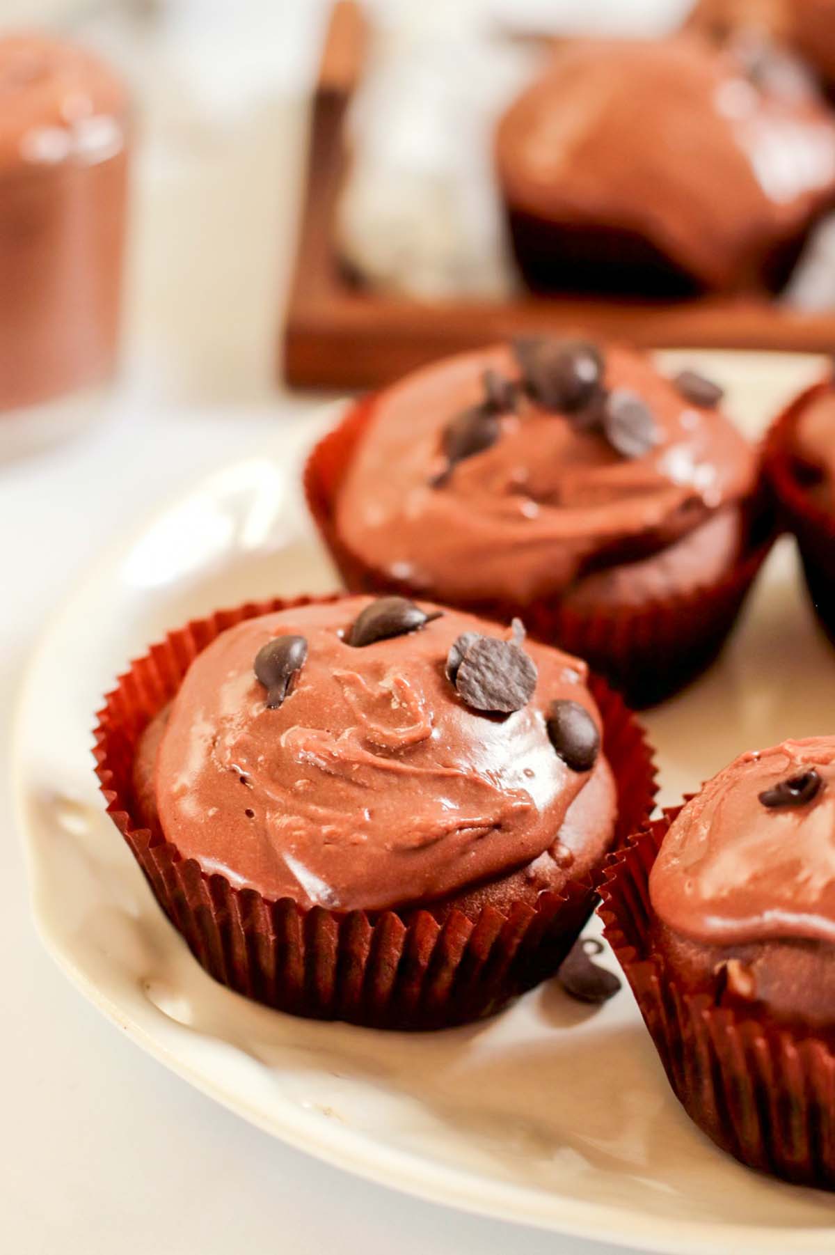 Chocolate cupcakes on a white plate.