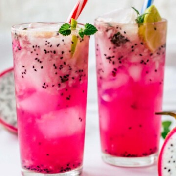 mojitos in two glasses with straws.