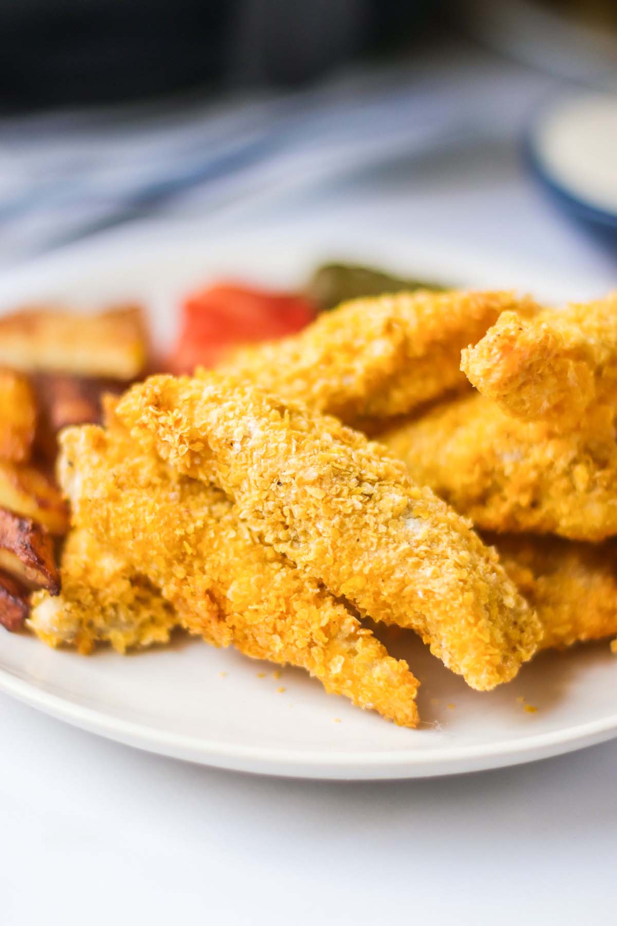 Crispy fish on a white plate.