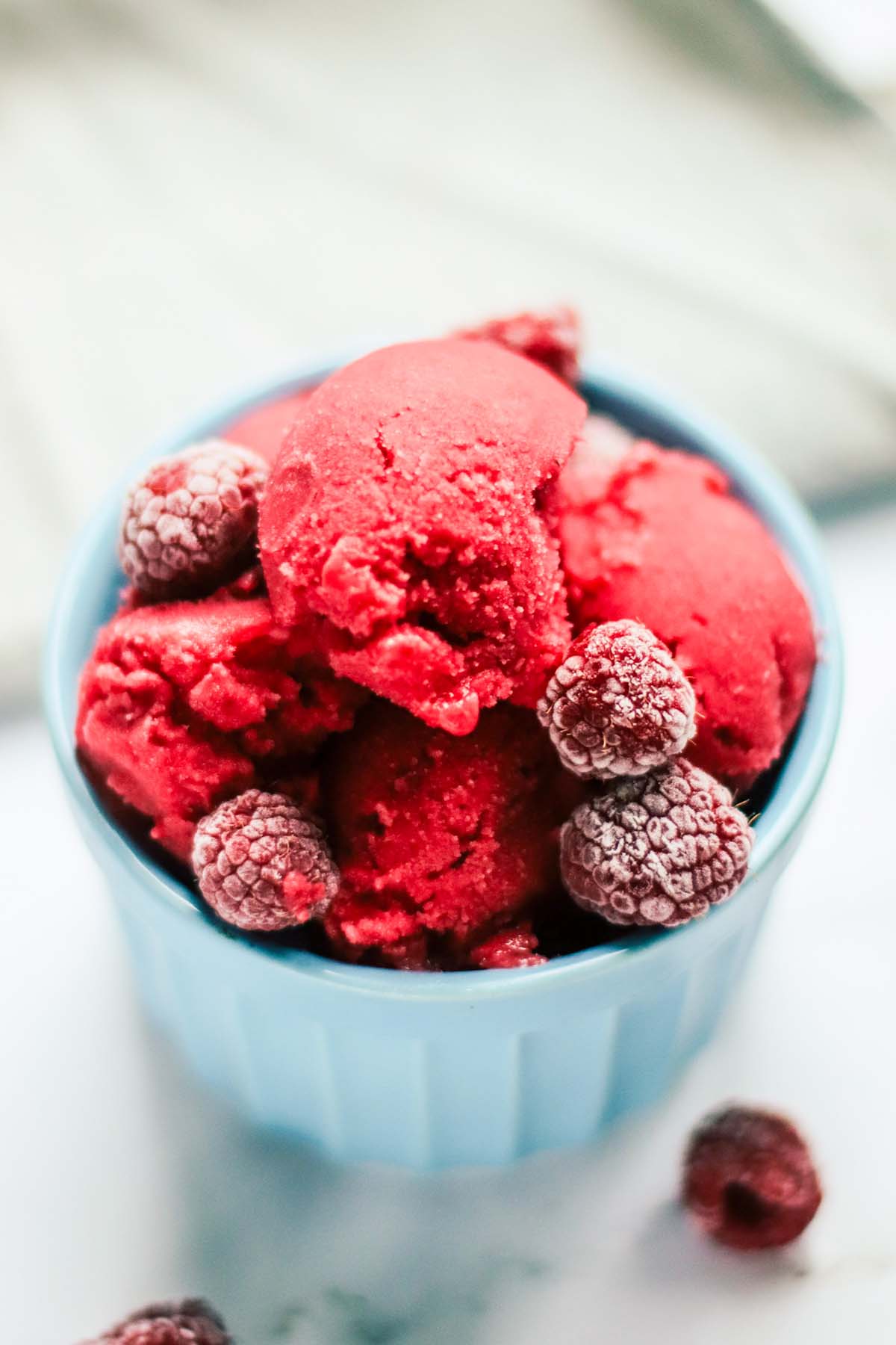 Sorbet scooped in a blue bowl.