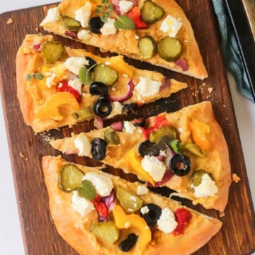 top view of a flatbread cut into four slices.