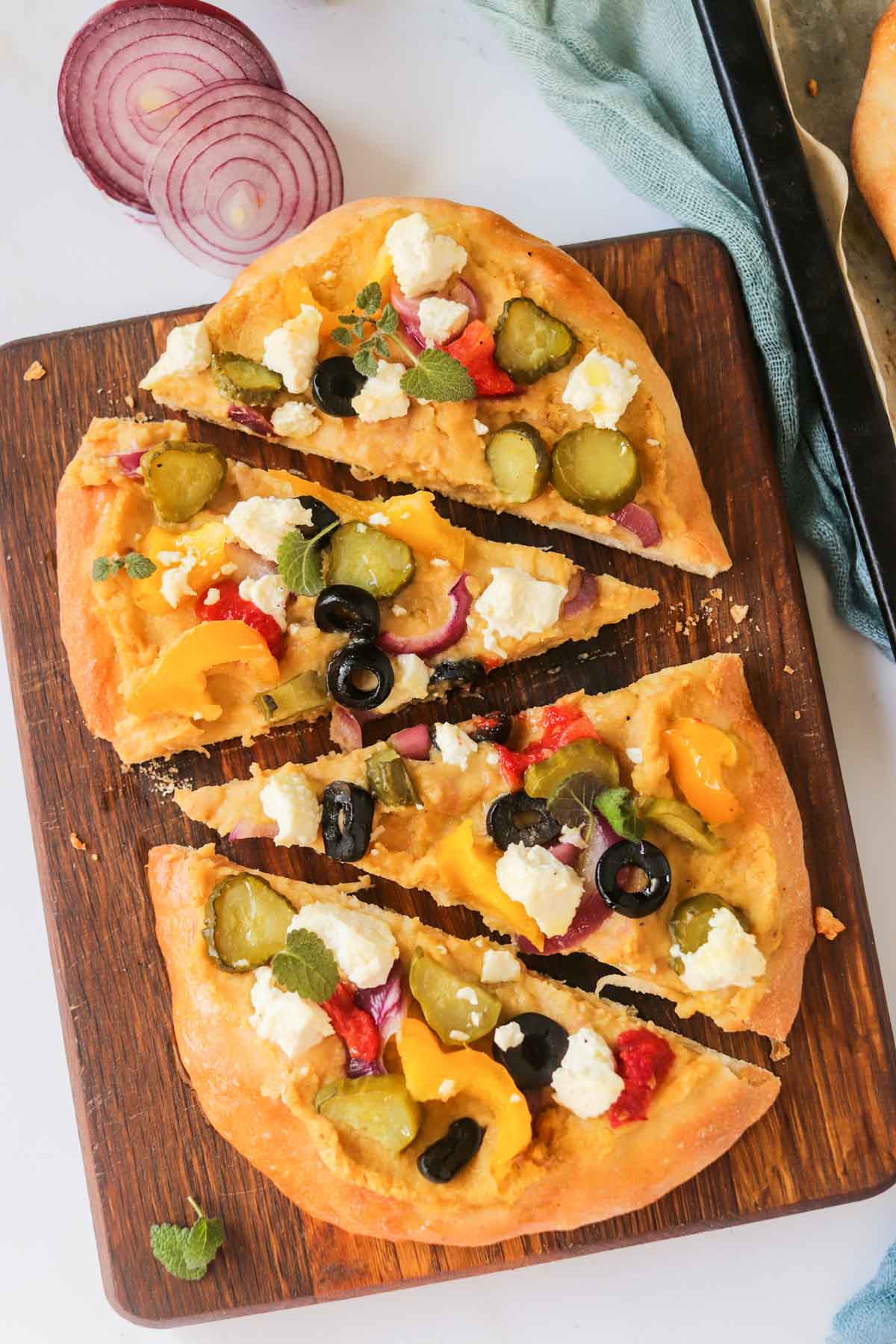 Flatbread pizza cut into four slices.