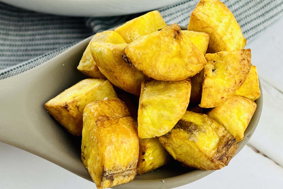 plantain croutons on a serving spoon.