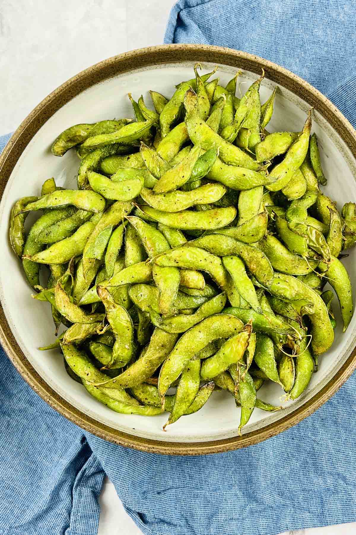 Cooked edamame in a bowl.