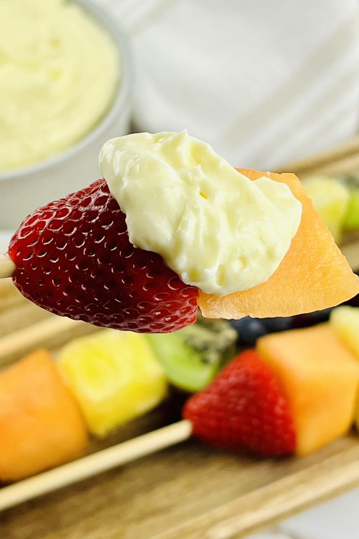 Dip on a fruit skewer.