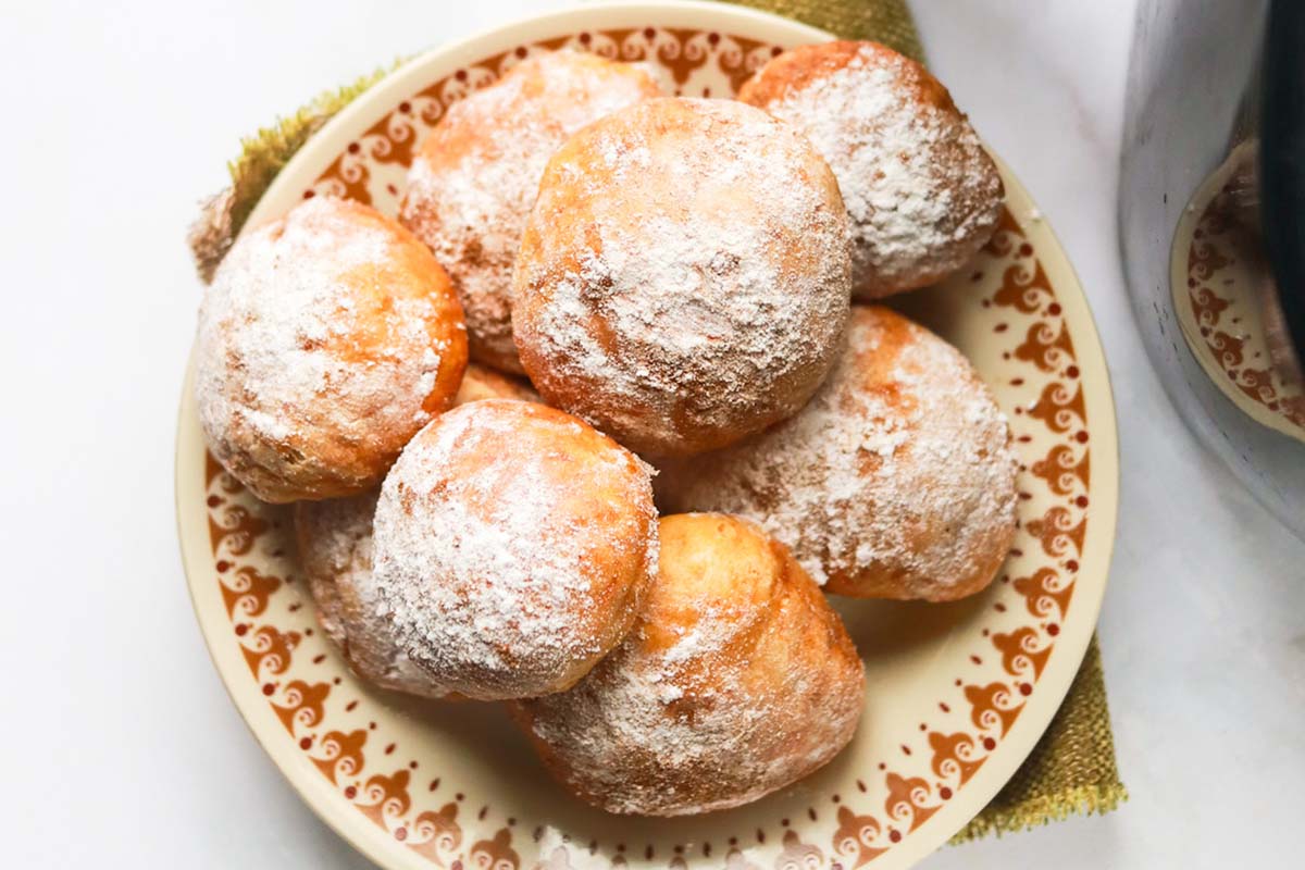 Pretzel bites on a brown plate.