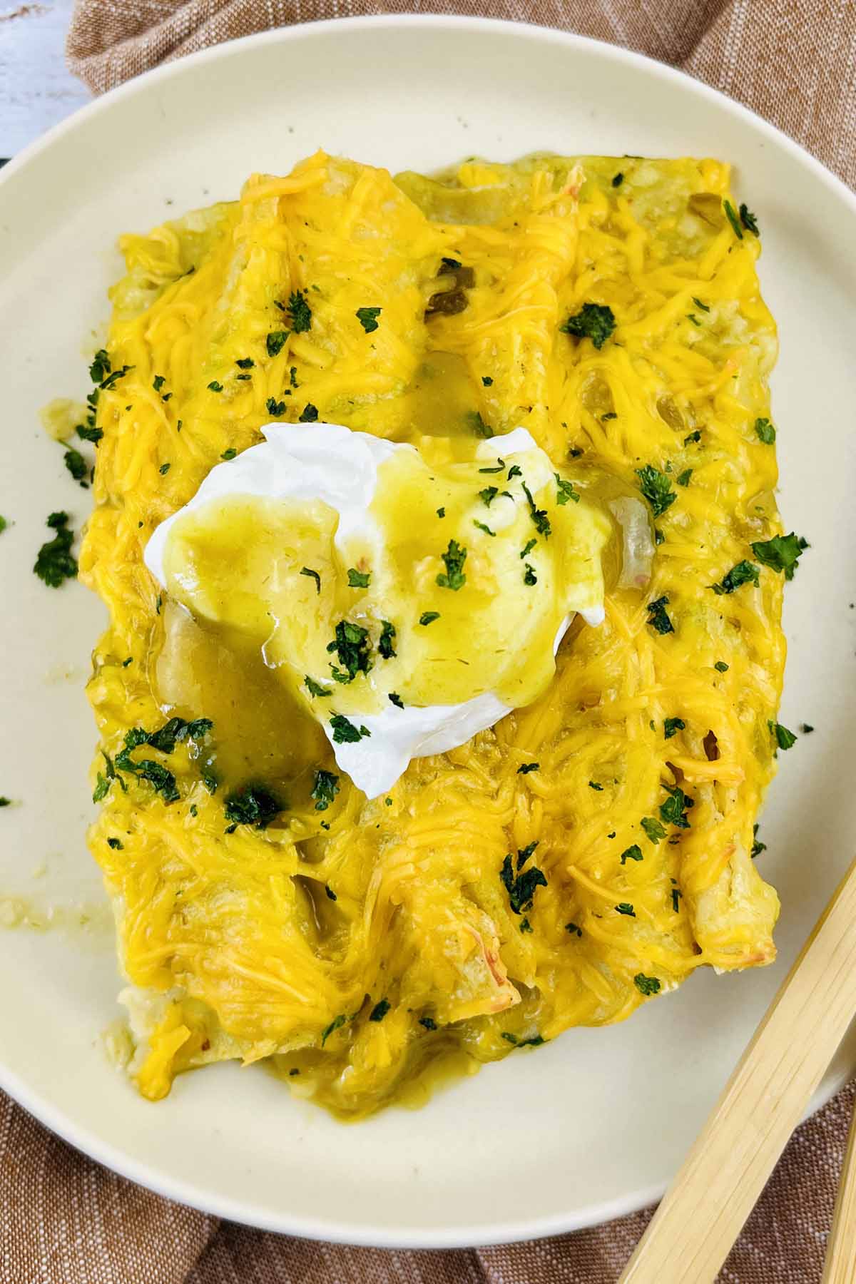 Enchiladas on a white plate.