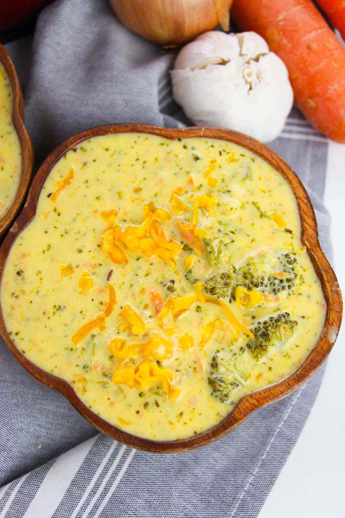 close up view of creamy broccoli cheddar soup.