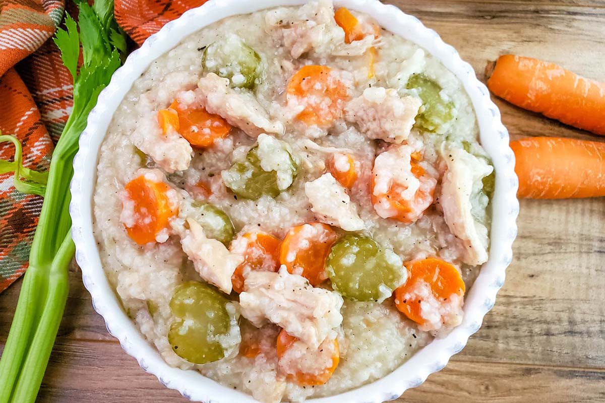 close up bowl of turkey with rice soup.