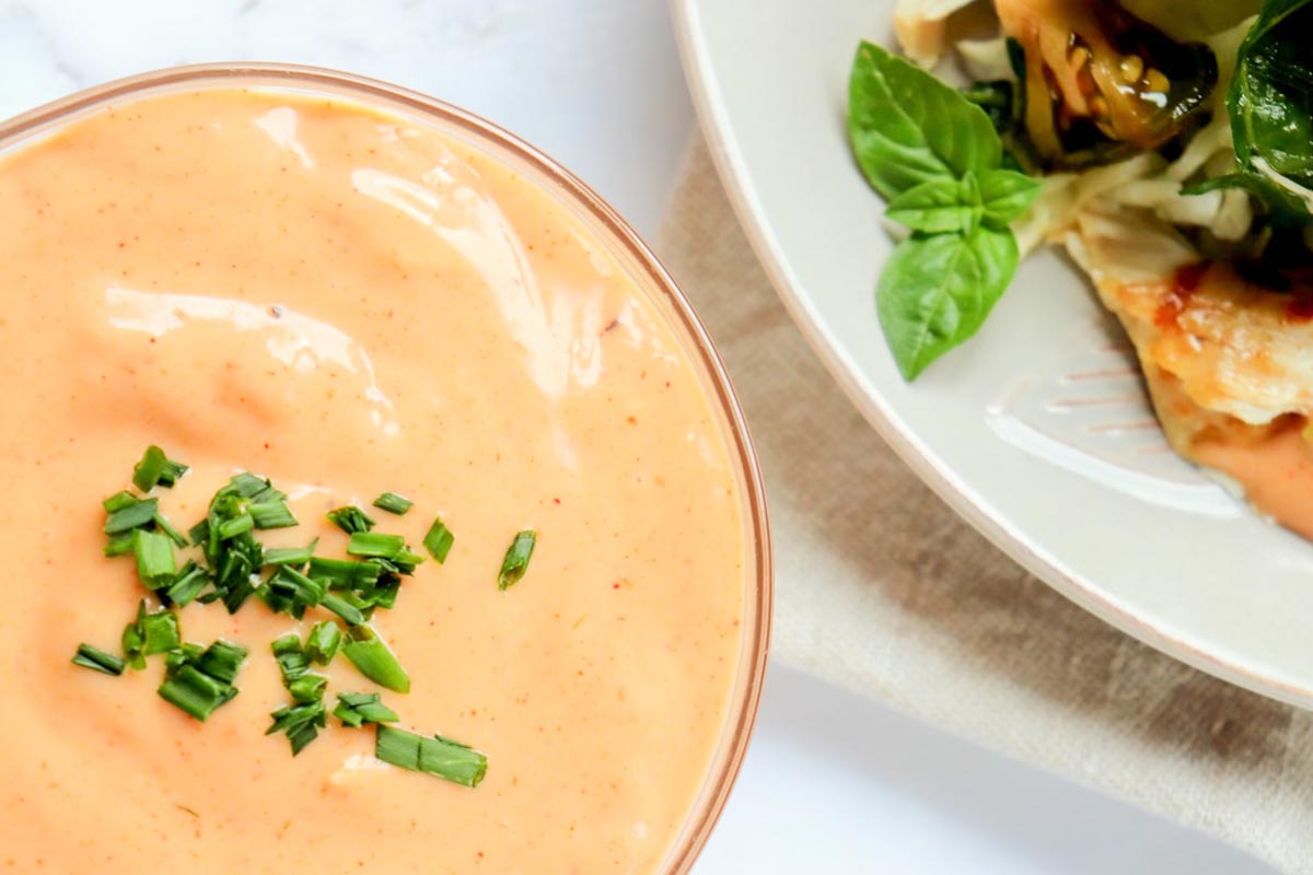 close up view of dressing in a glass bowl.