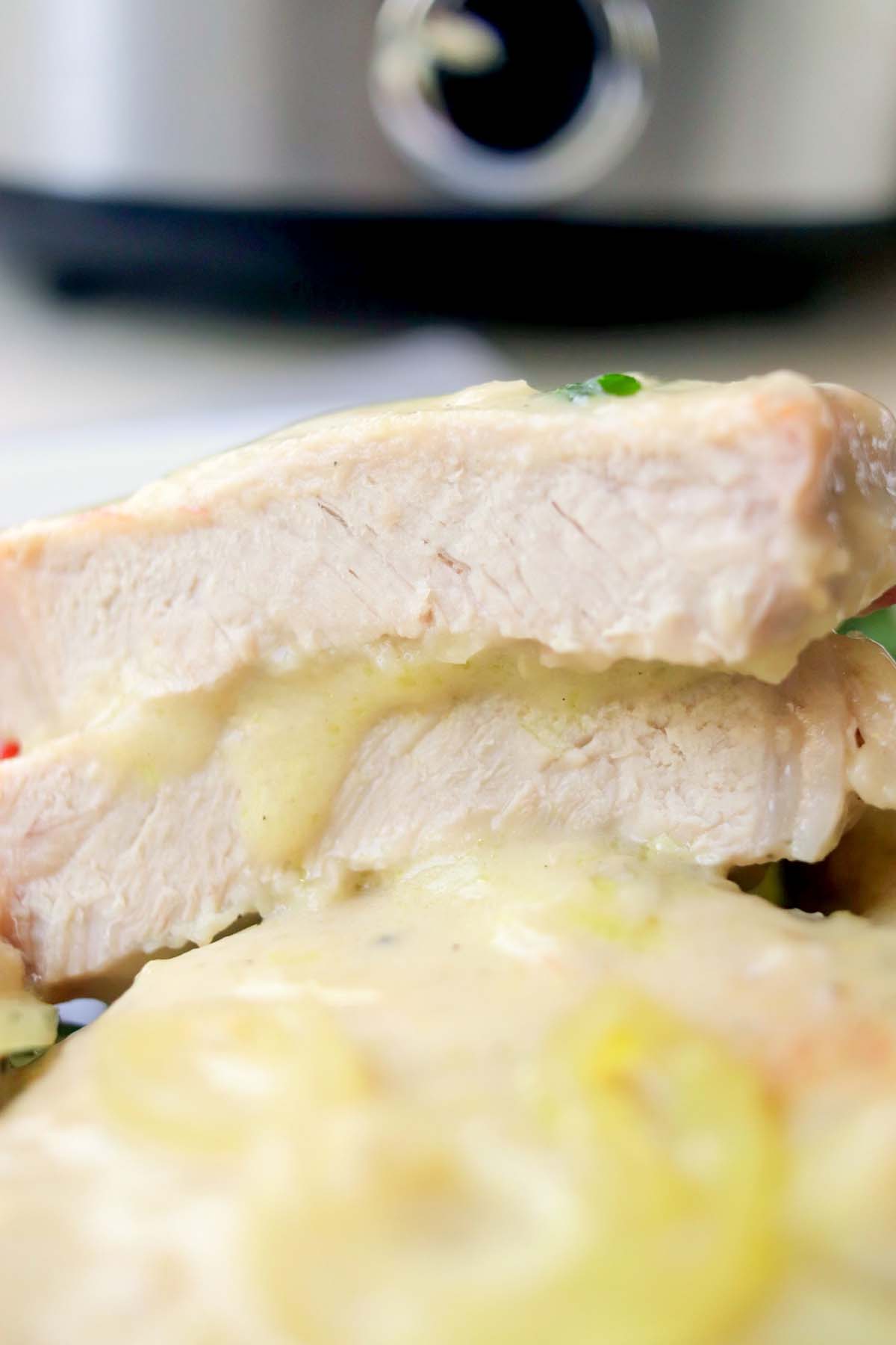 close up view of a pork chop cut in half.
