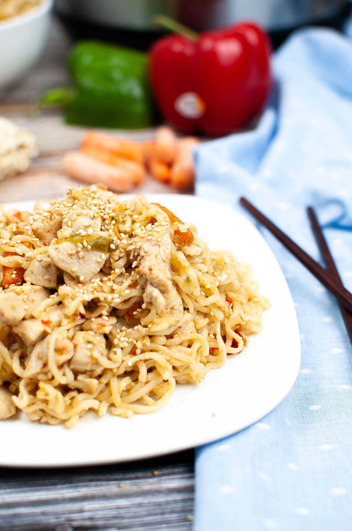 Ramen noodles topped with sesame seeds.