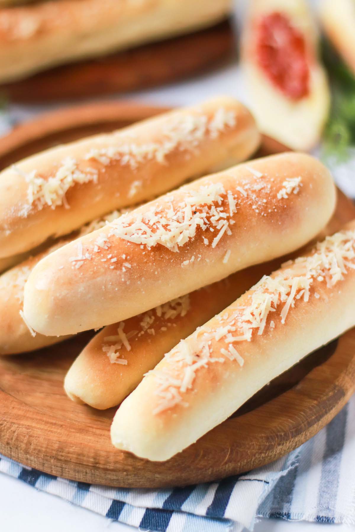 side view of breadsticks on a platter.