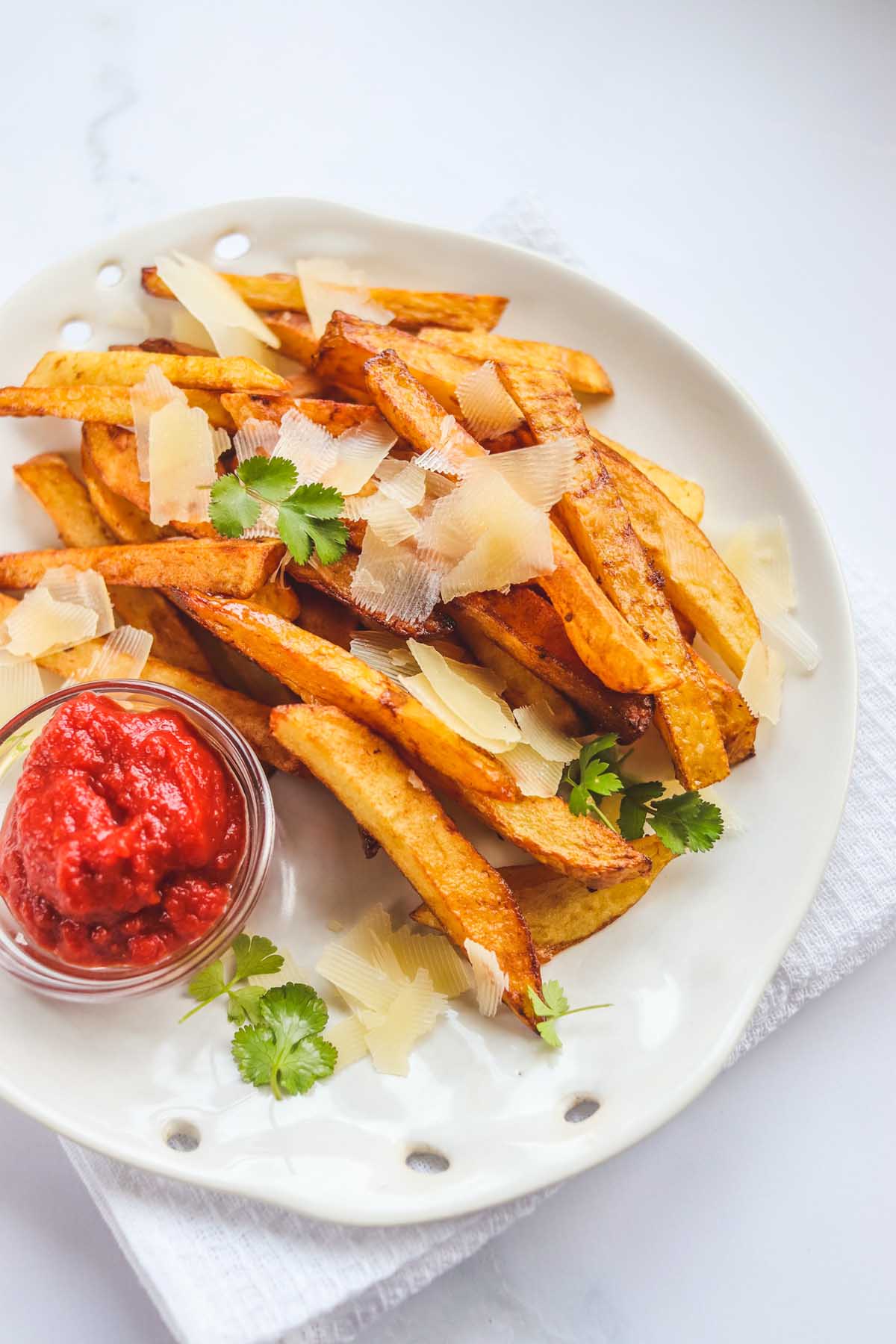 French fries topped with parmesan cheese.