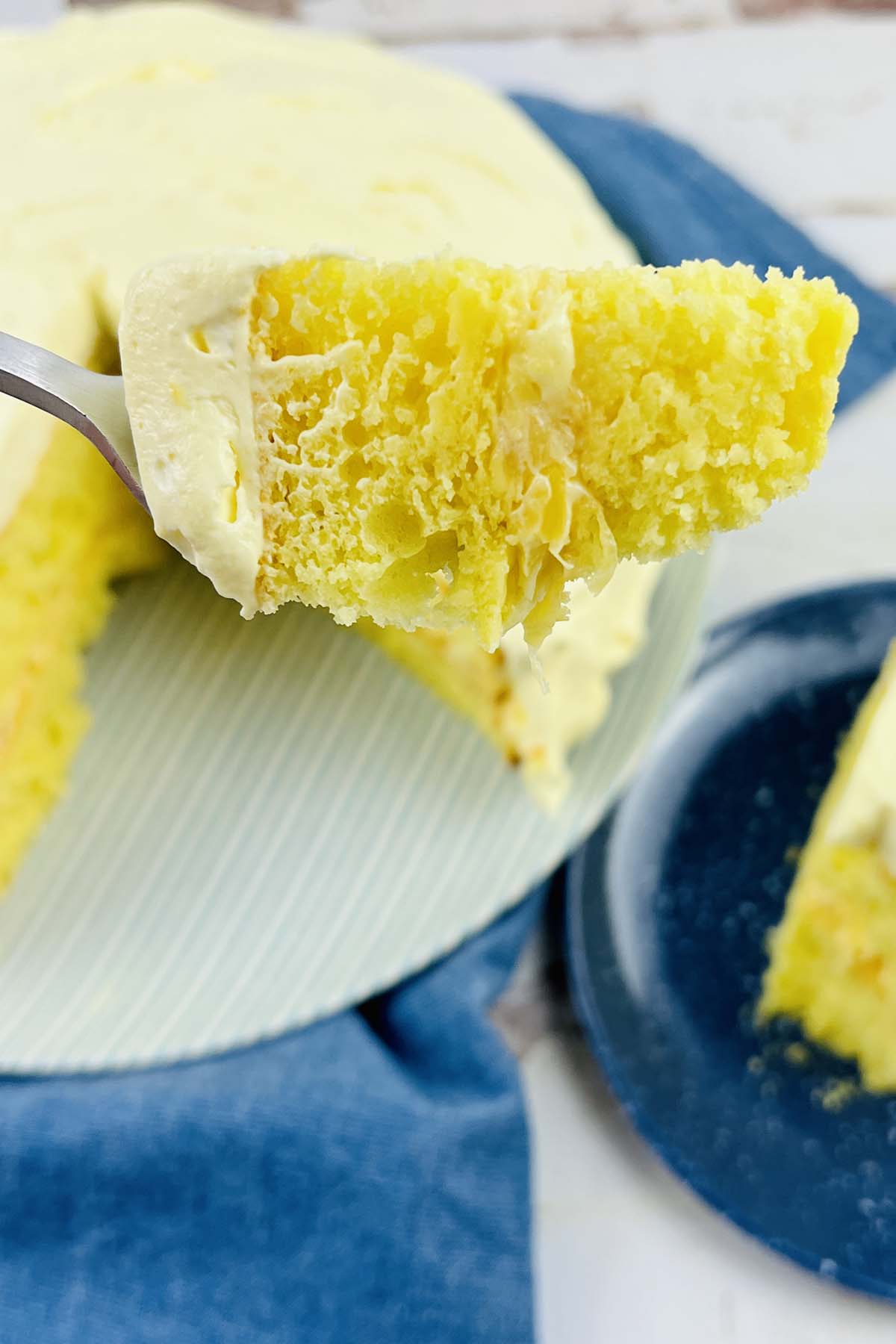 A piece of lemon cake on a fork.