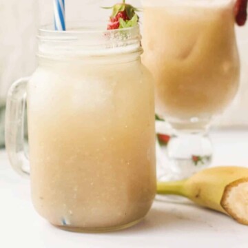 side view of two glasses of juice.