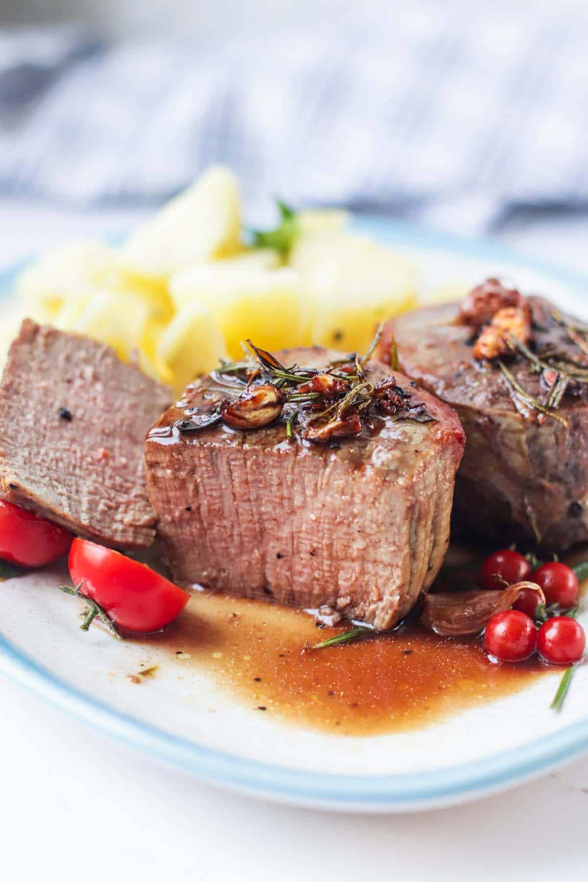 Filet mignon steak cut in half.