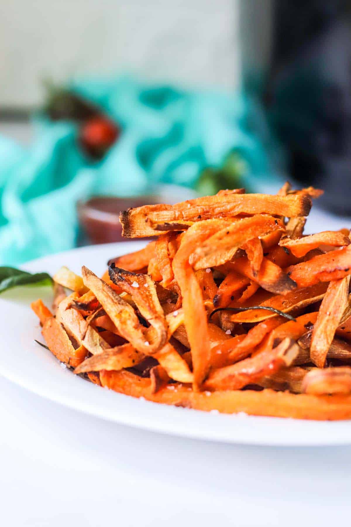 Sweet potato fries on a white plate.