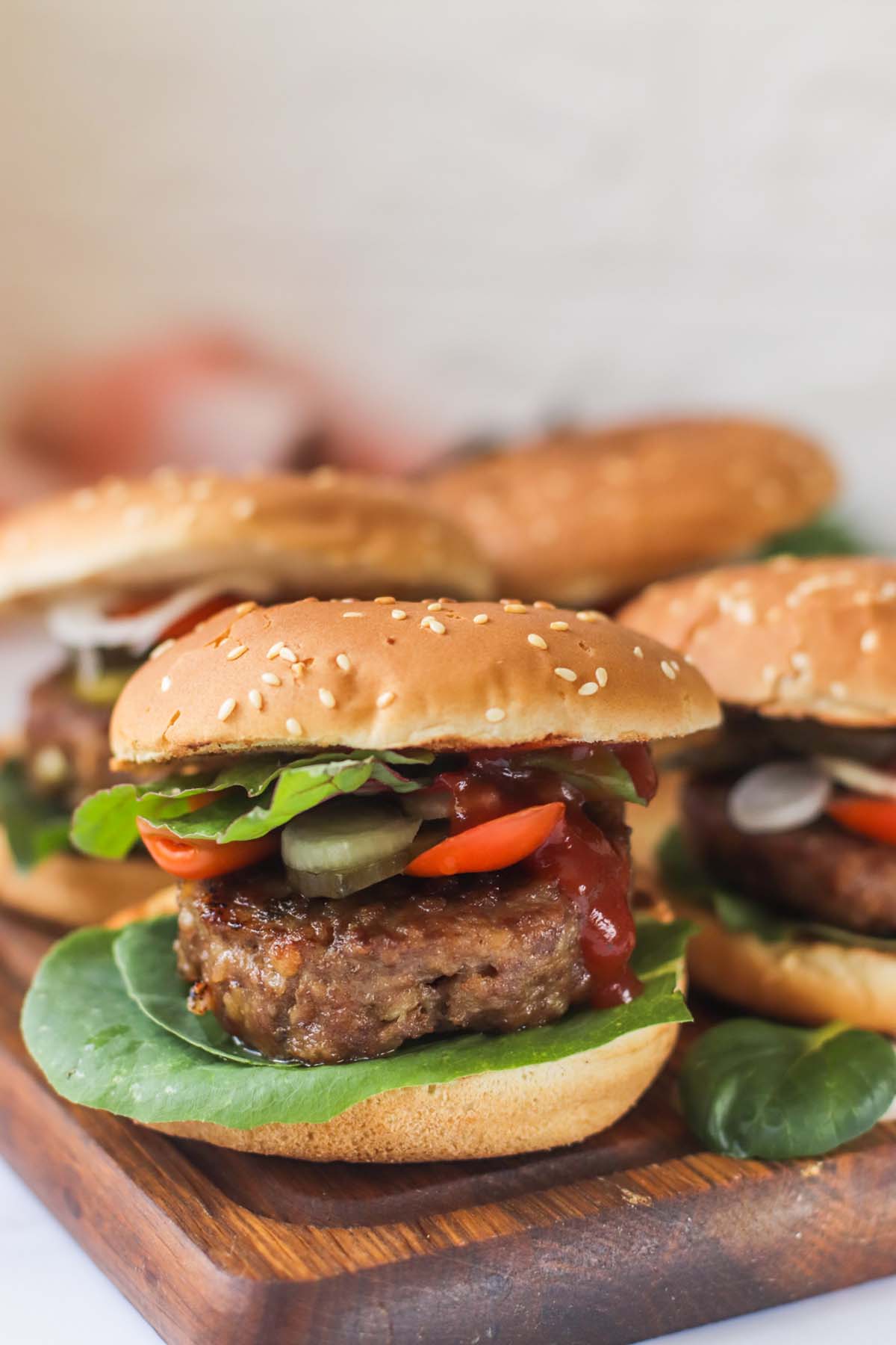 Turkey burger topped with lettuce, tomato, pickles and ketchup.