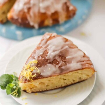 Slice of cake on two white plates.