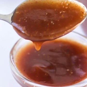 Sauce dripping off a spoon.