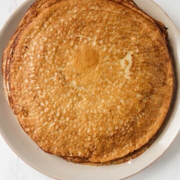 Stack of pancakes on a plate.