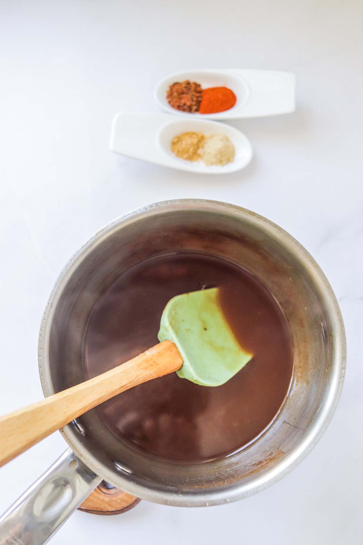 Buffalo sauce cooking in a pot.