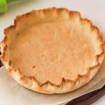A baked crust on a wood platter.