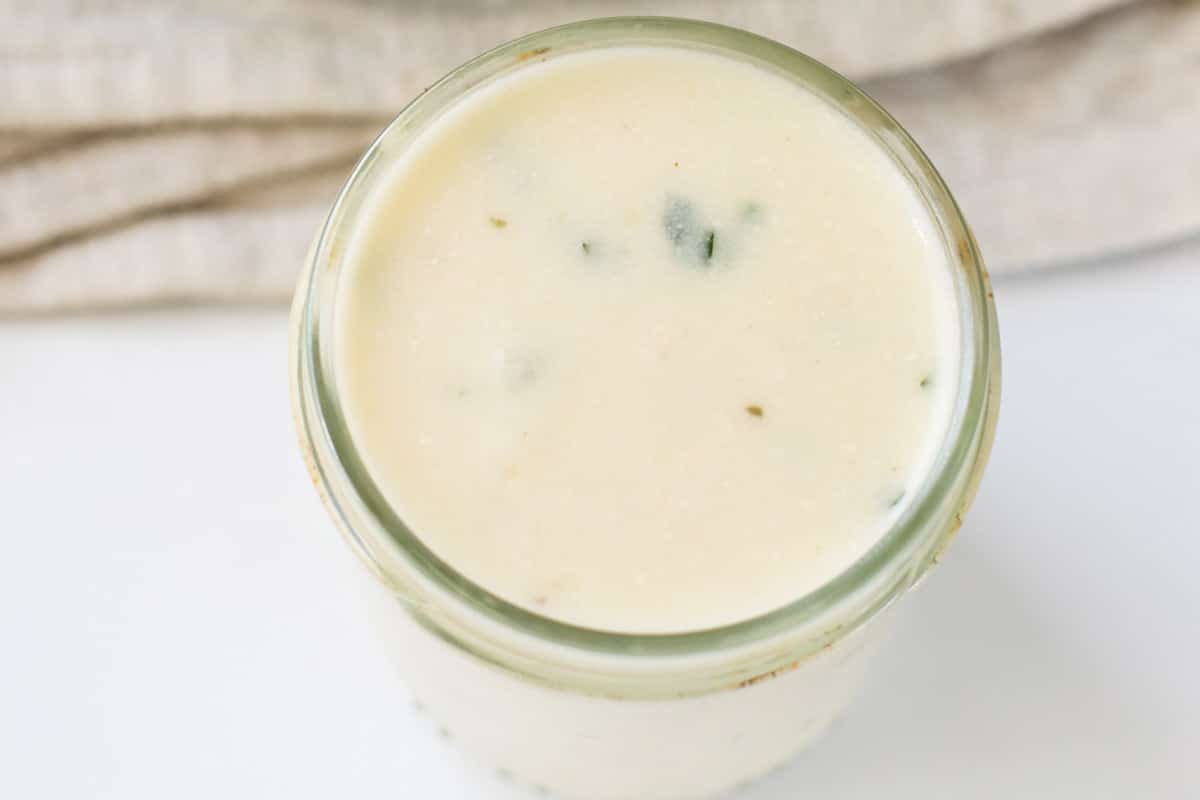 White sauce in a glass jar.