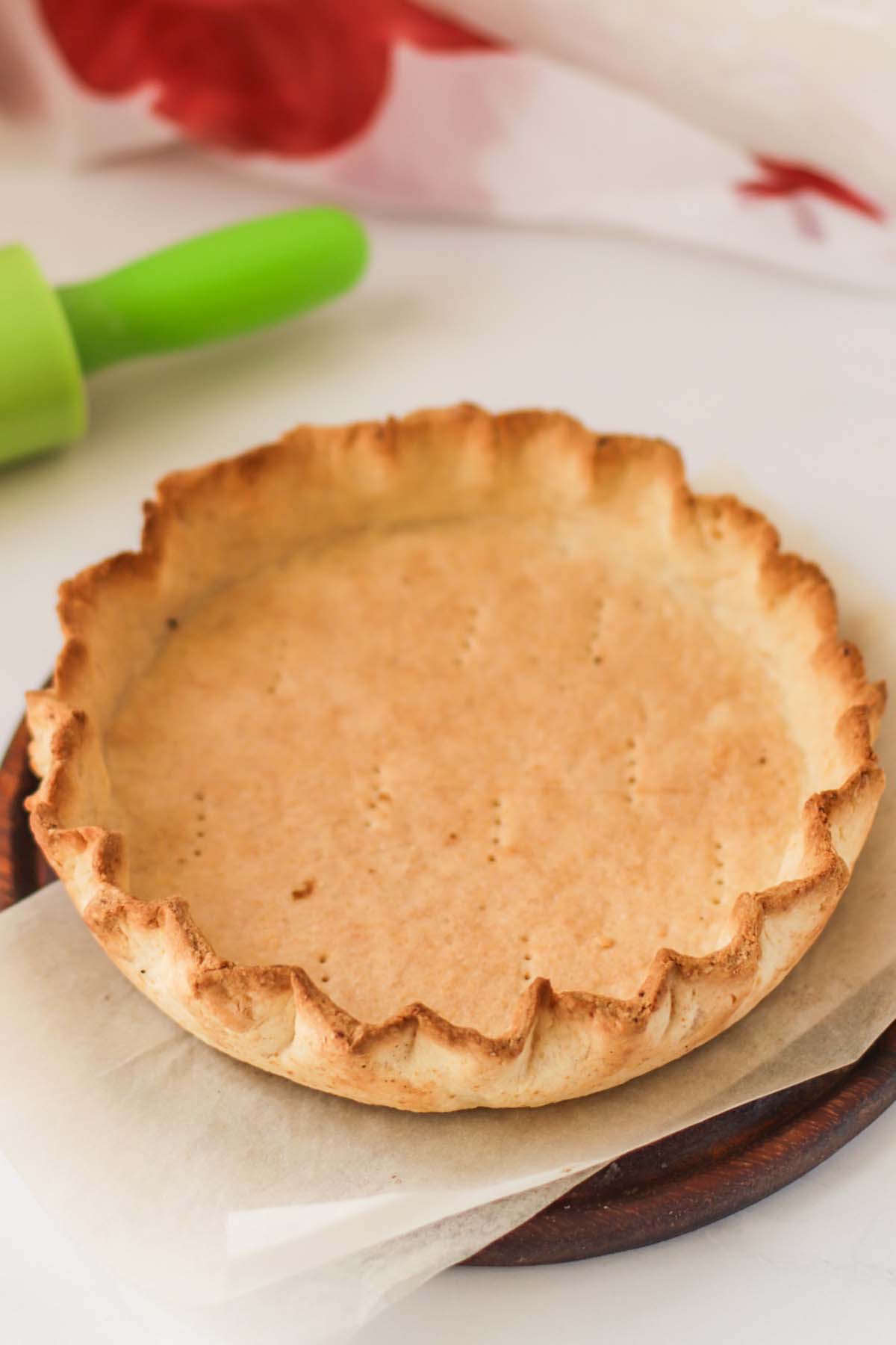 A baked crust on a wood platter.