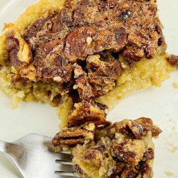 A bite of pie on a fork.