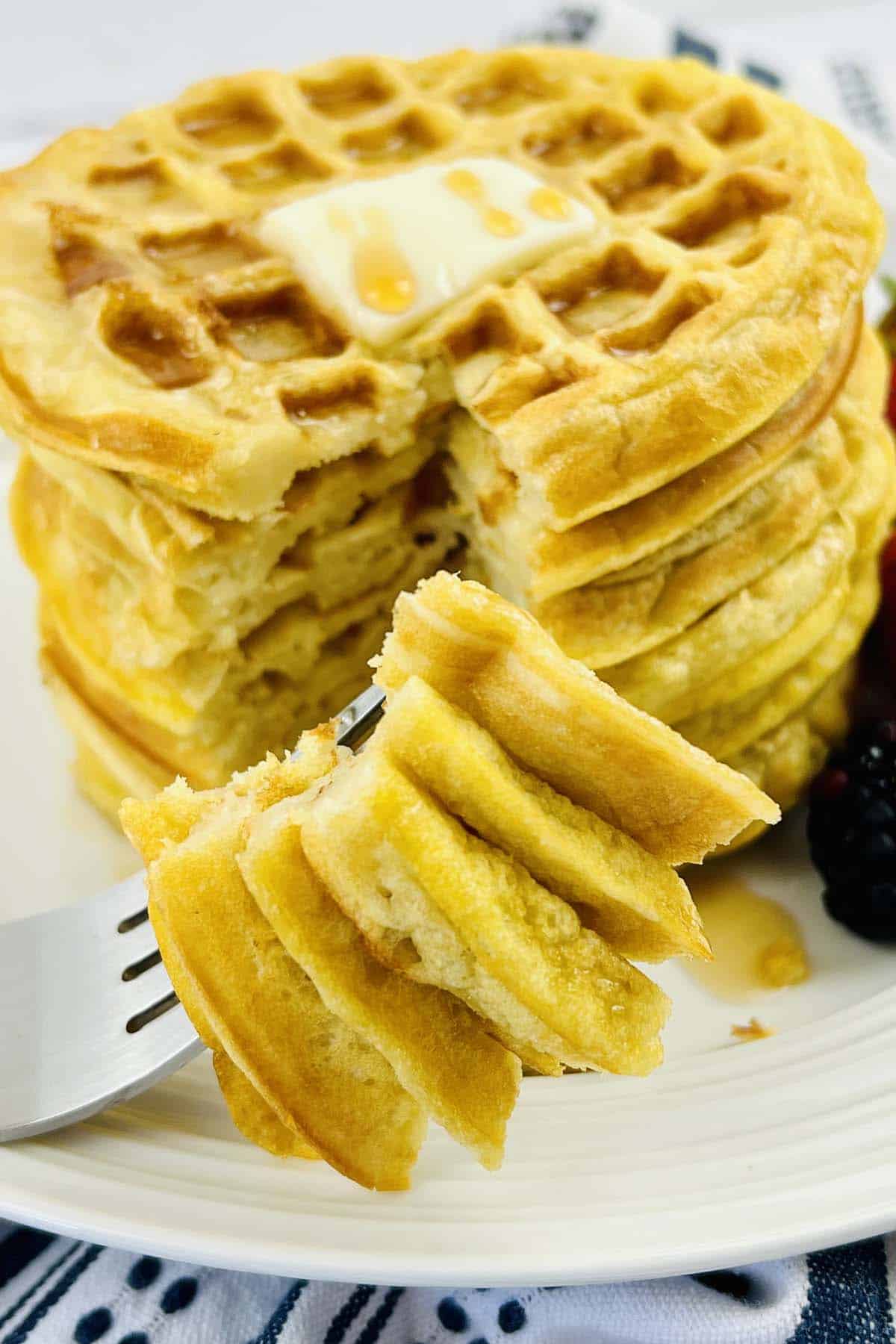 A bite of waffles on a fork.